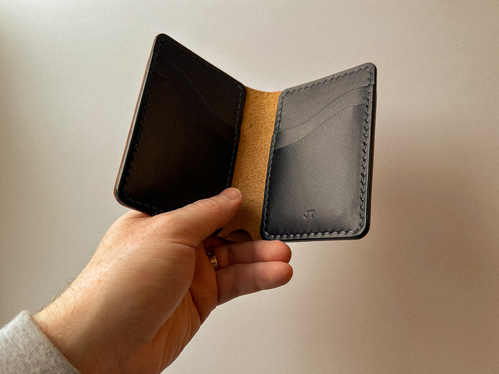 dark interior of custom build your own leather bateston bi-fold wallet