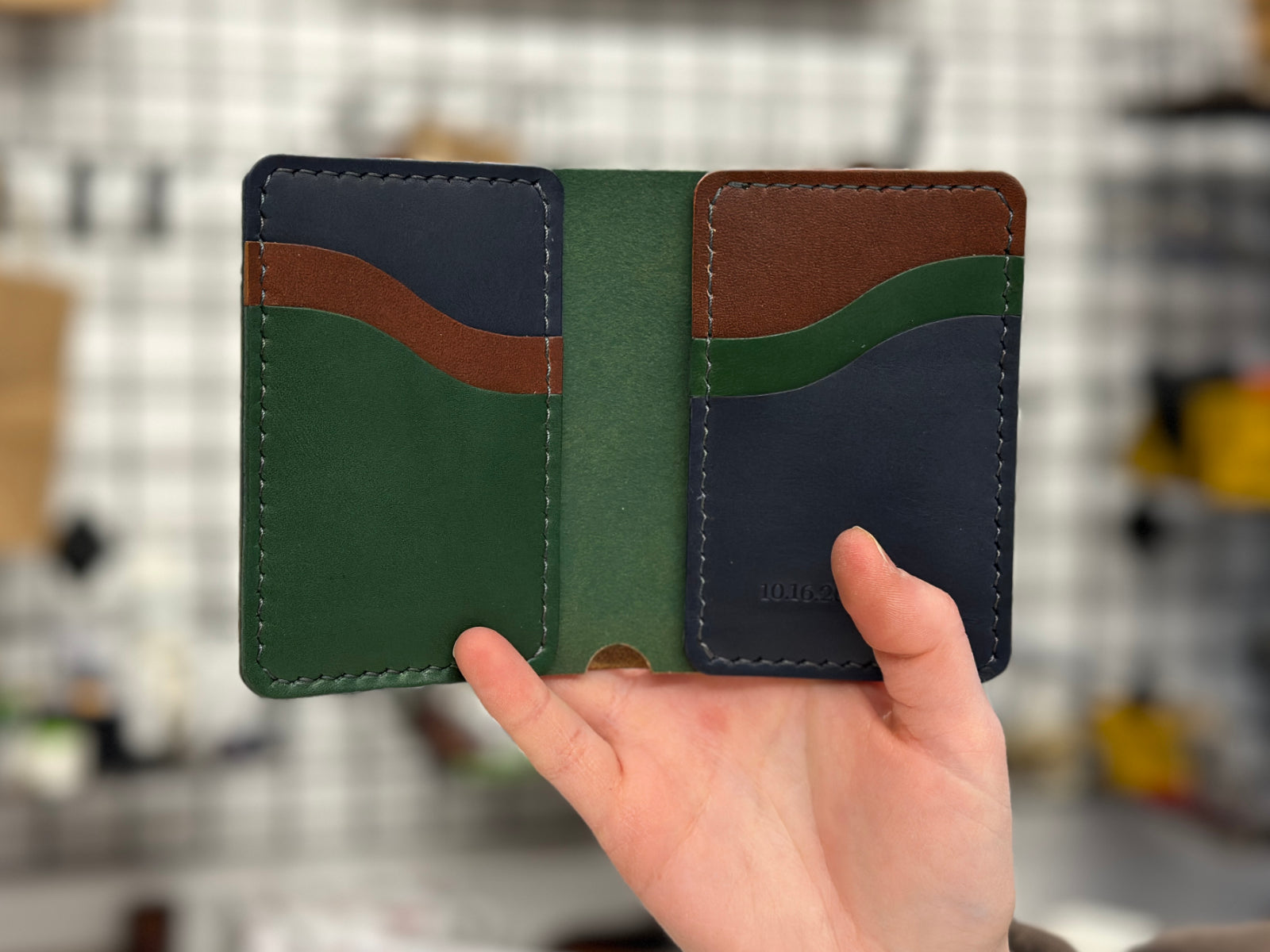 build your own leather bateston wallet with mix of navy, pine and brown pockets