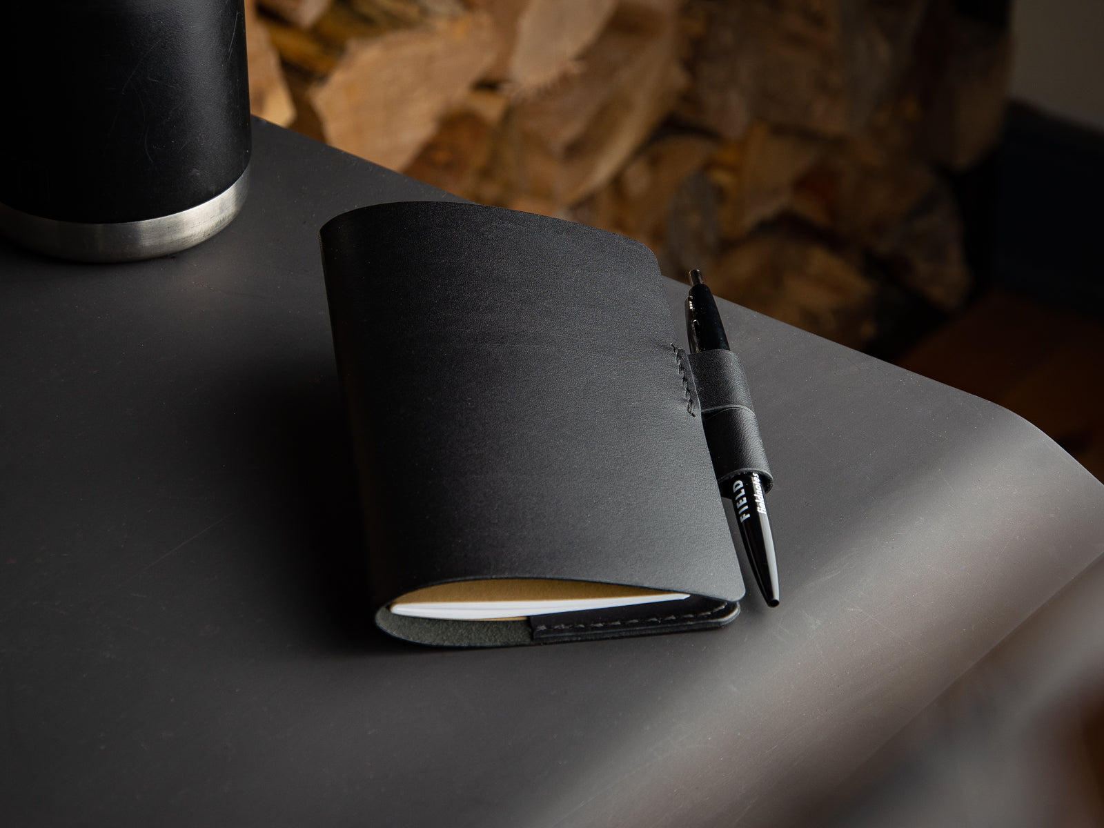 Closed over black notebook sleeve with fieldnotes notebook
