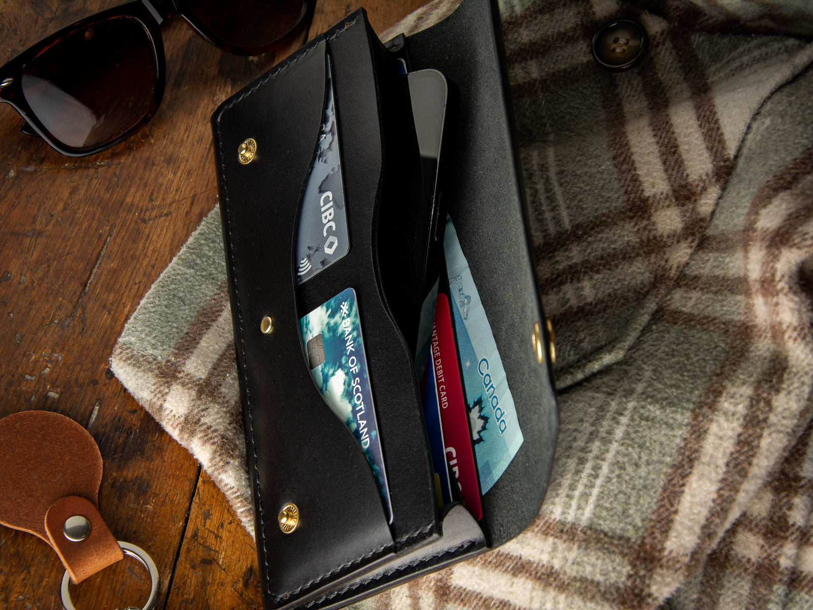 Glendale clutch wallet with optional wrist strap in black full grain leather