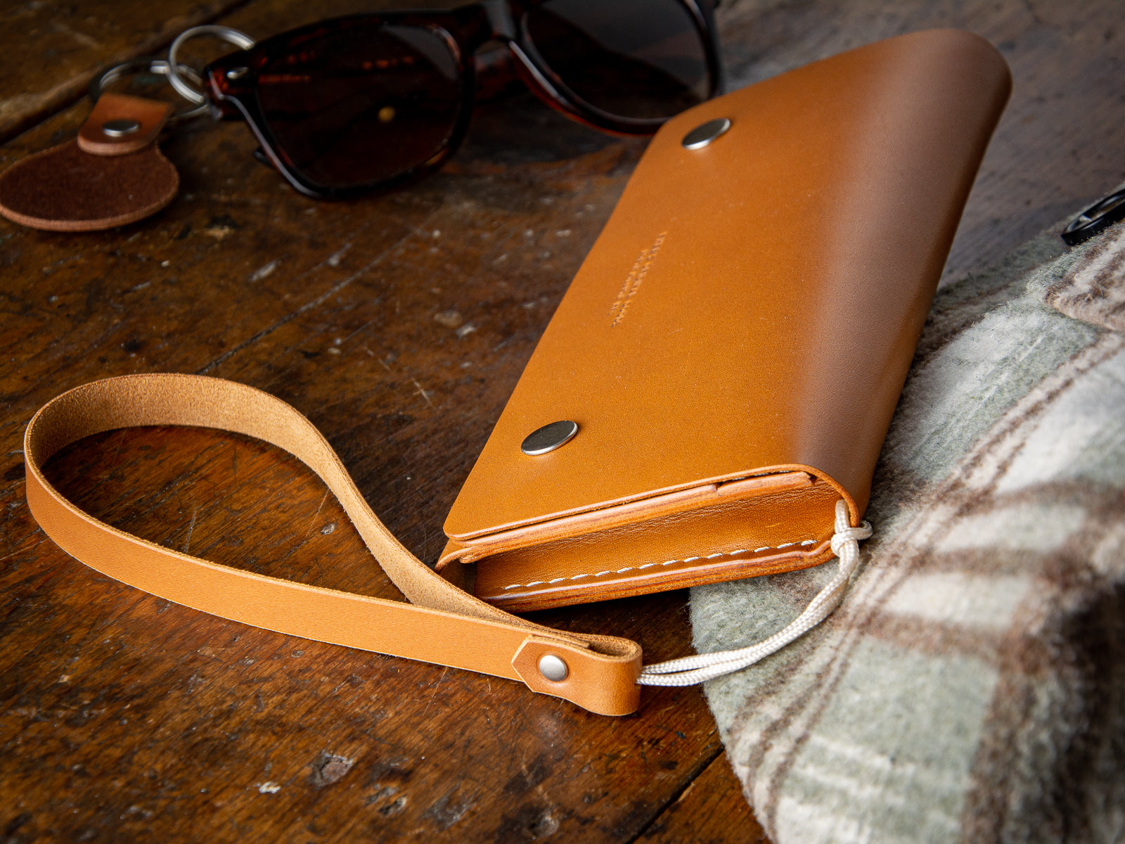 Glendale clutch wallet with optional wrist strap in tan full grain leather