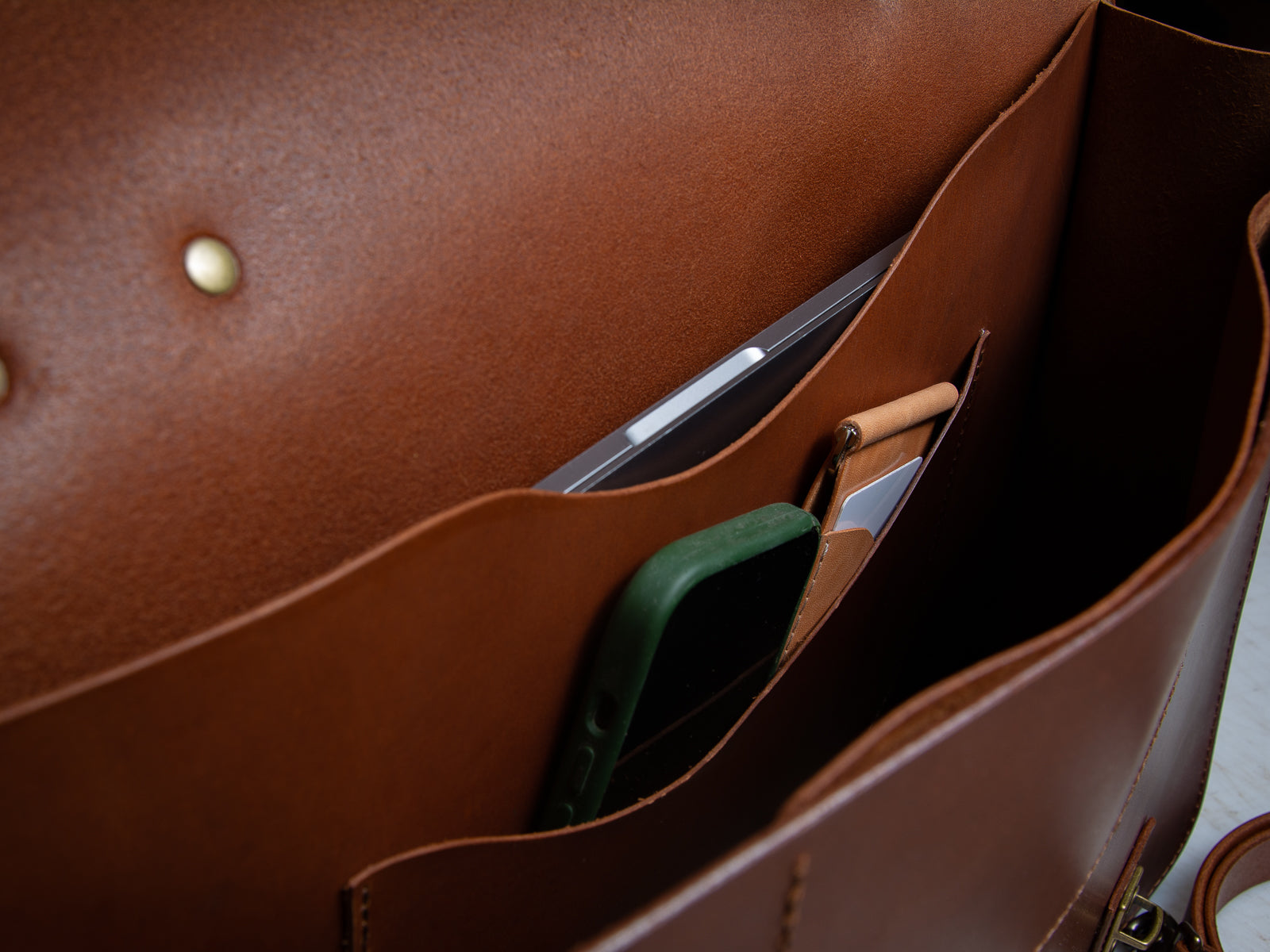 Close up inside view of the glengarry laptop bag in tan brown