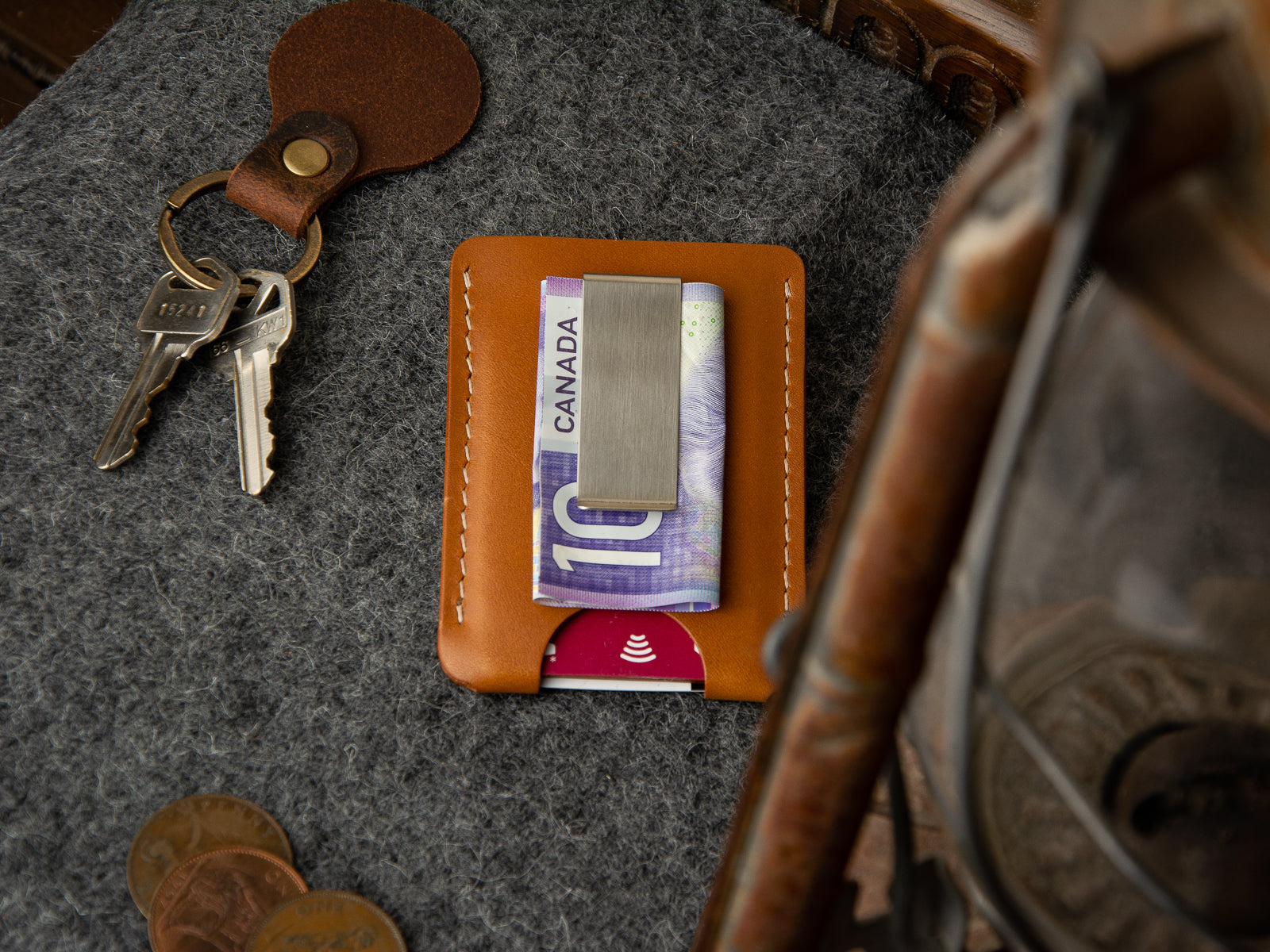 back of tan full-grain leather wallet with brushed stainless moneyclip on the back