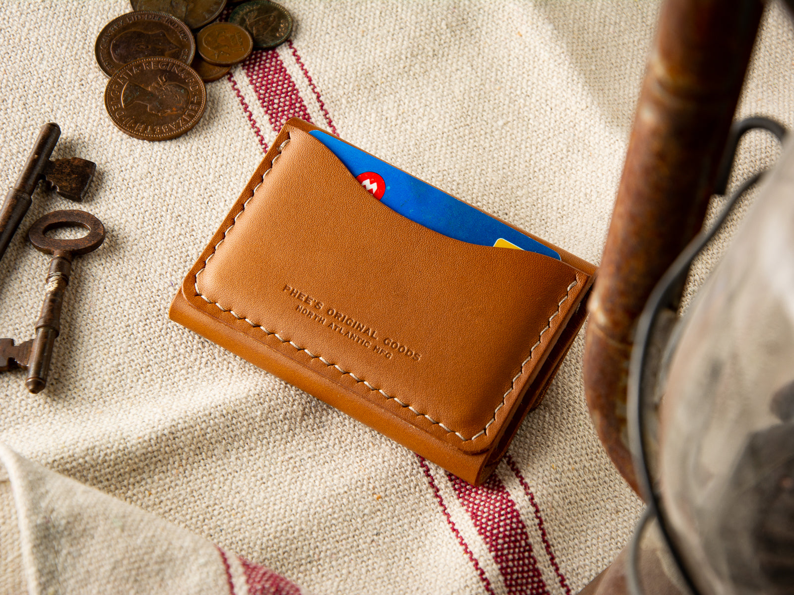 back of tan hand sewn number 11 wallet in tan veg-tan leather showing exterior card slot