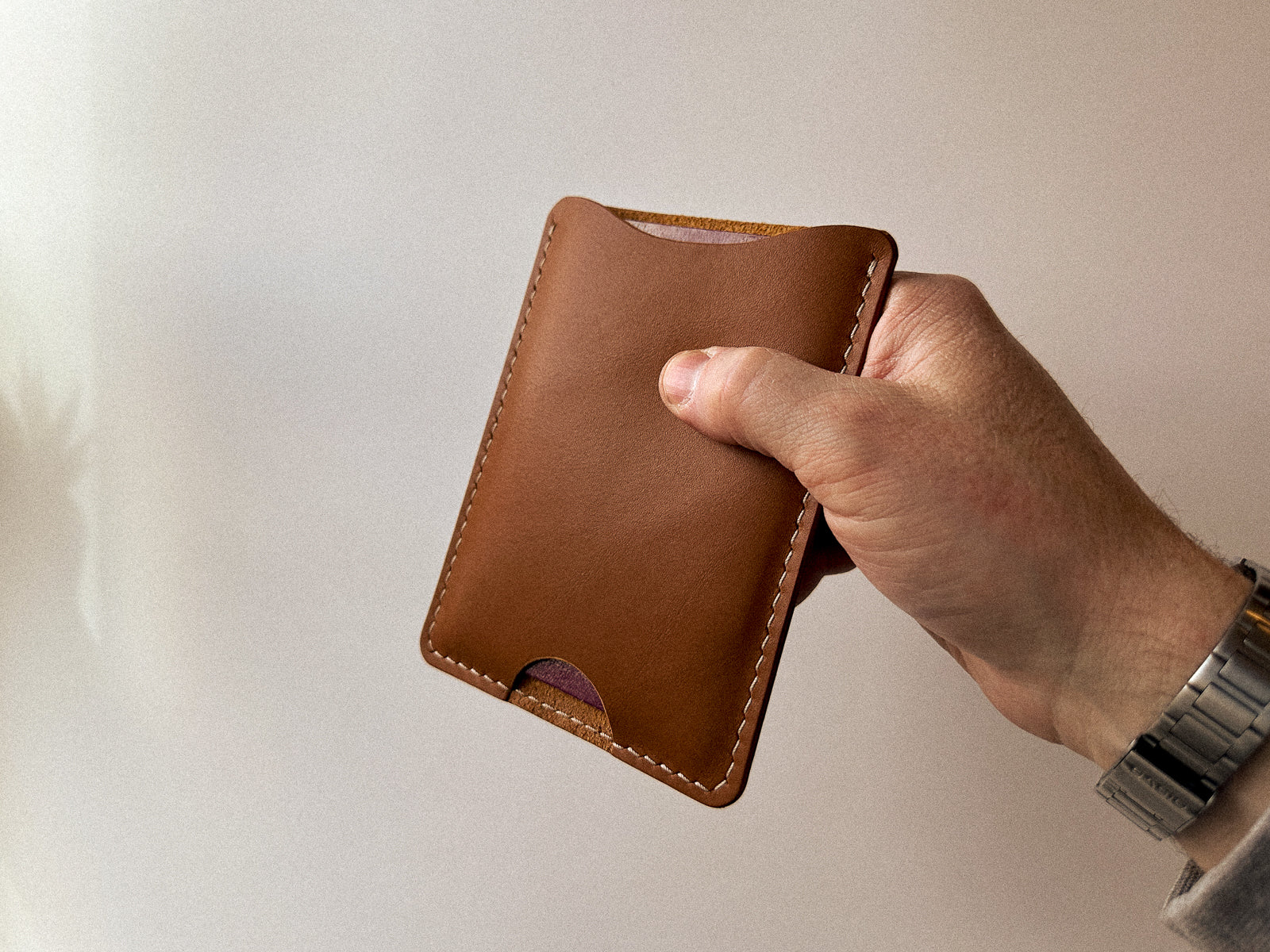 Leather passport slip in tan leather with taupe handstitching