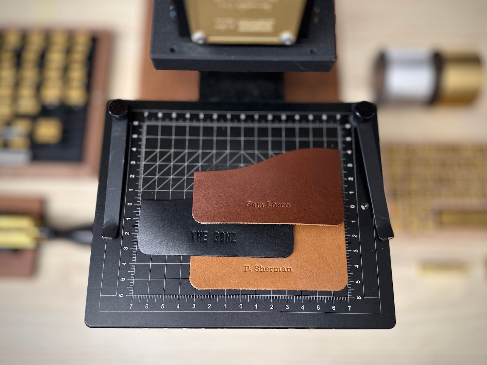 brown and black leather wallet pockets with custom engraving