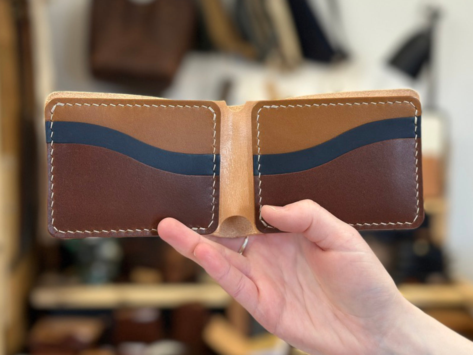 Build your own custom leather bucklaw wallet in brown, navy and tan