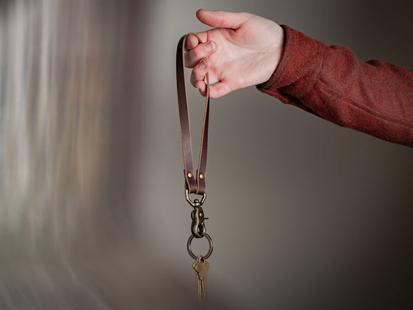 Key Lanyard held in hand with the trigger snap and keyring hanging down.