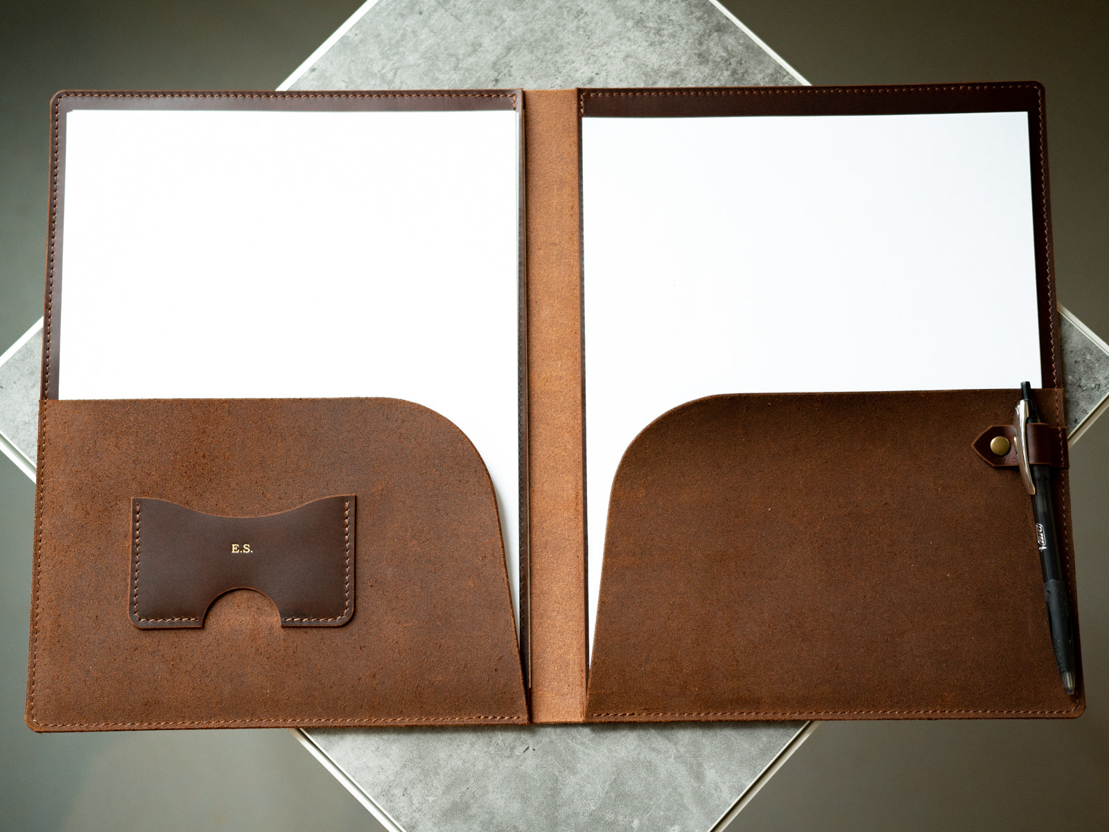 brown leather portfolio embossed with gold foil initials