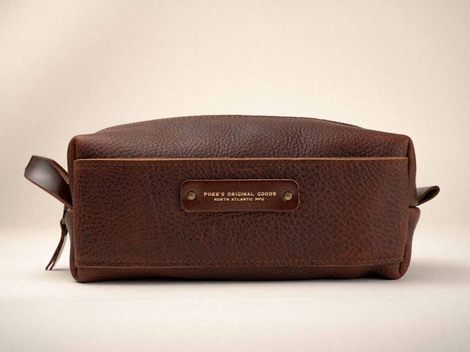 Side of brown pebbled leather washabuck shaving kit with side magnetic pocket