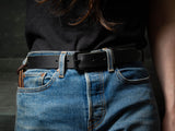 The Black Ashfield belt is shown here being worn with a pair of blue jeans.