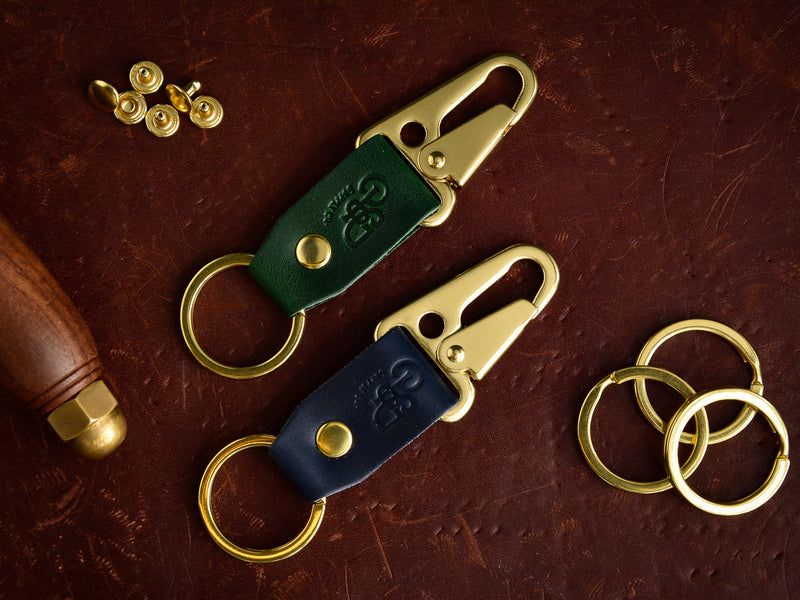 Stubby keychain in pine green and navy with brass hardware